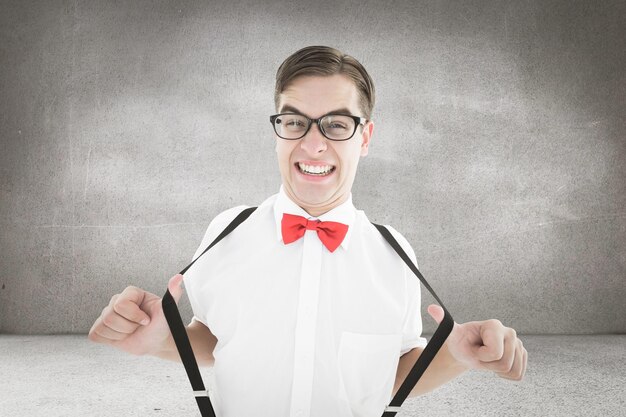 Premium Photo | Composite image of geeky hipster pulling his suspenders