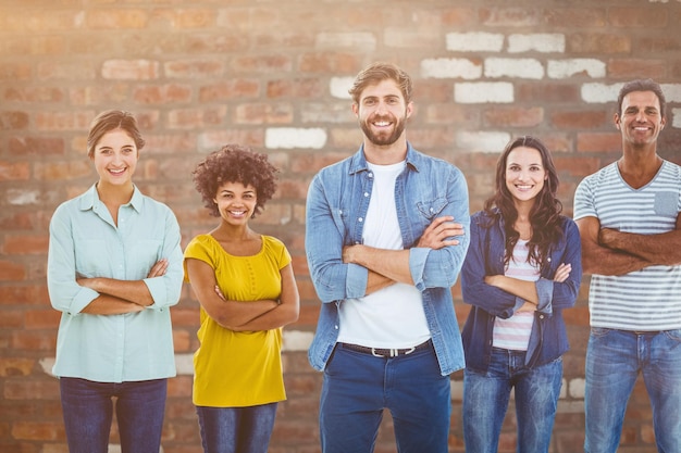 Composite image of group portrait of happy young colleagues