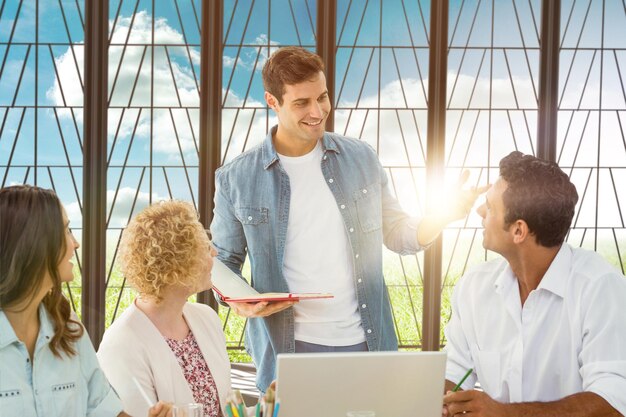 Composite image of group of young colleagues in a meeting