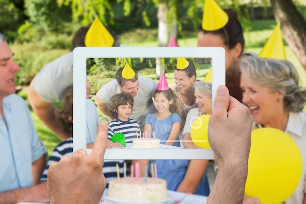 Photo composite image of hand holding tablet pc