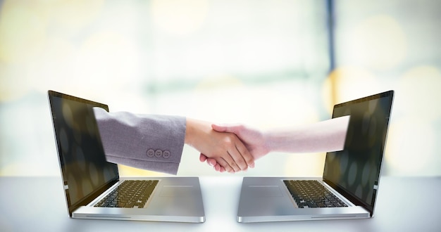 Composite image of handshake between two women