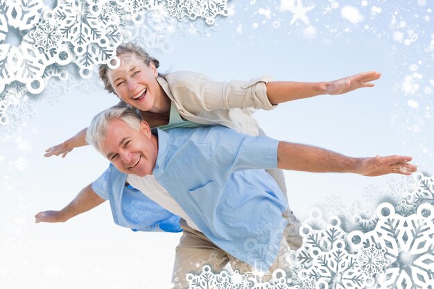 Photo composite image of happy casual couple having fun against snow