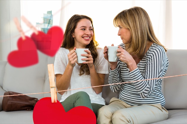 Composite image of happy women holding coffee mug