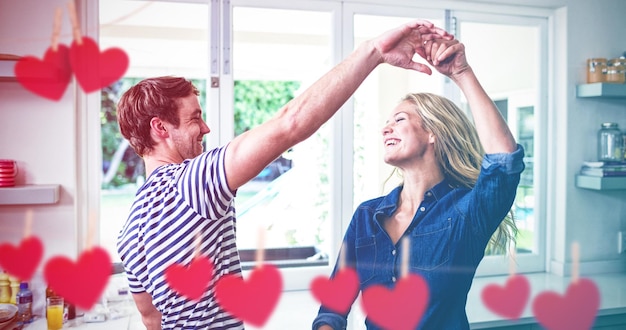 Composite image of hearts hanging on a line