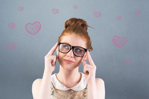 Composite image of hipster redhead looking up thinking