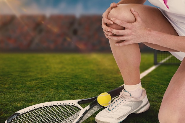 Composite image of injured tennis player