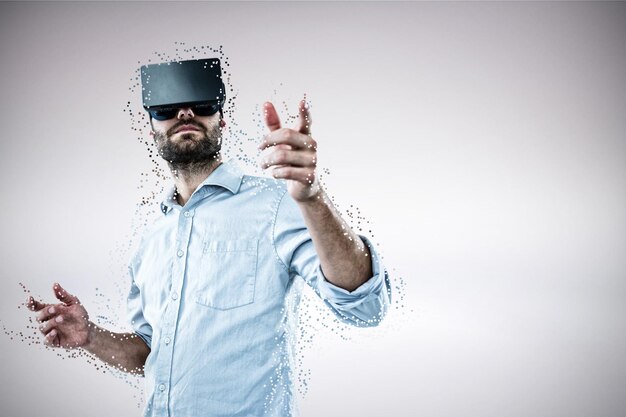 Photo composite image of low angle view of man using oculus rift headset