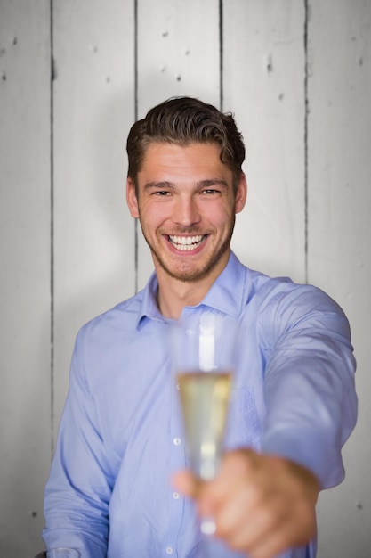 Composite image of man offering champagne