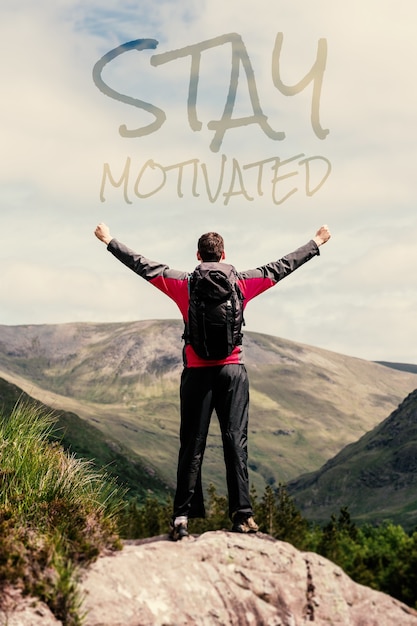 Photo composite image of man standing at hill top cheering