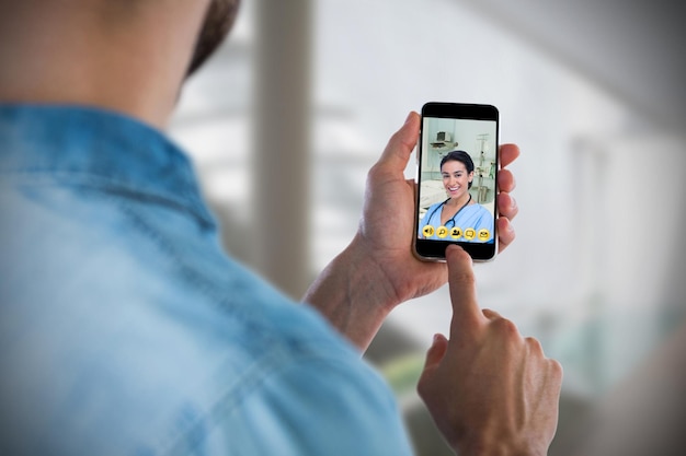 Composite image of man using mobile phone