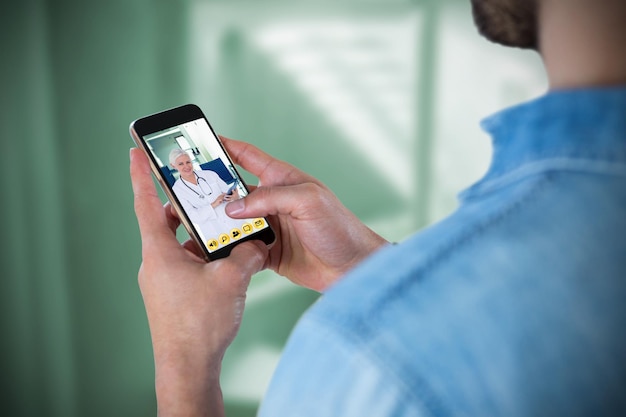 composite image of man using mobile phone