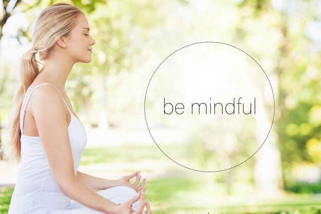 Composite image of mid section of calm young woman meditating