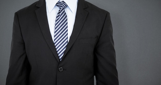 Composite image of mid section of well dressed businessman