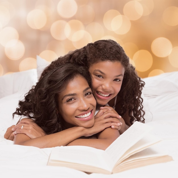 Composite image of mother and daughter reading book together on bed