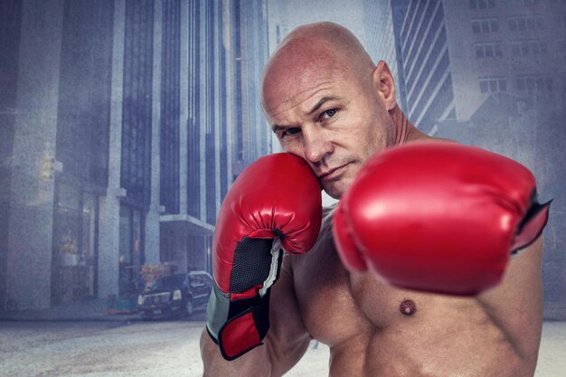 Composite image of portrait of boxer with fighting stance