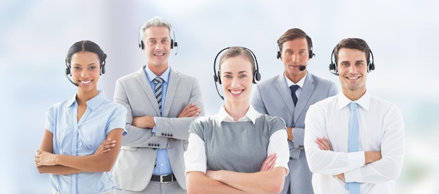 Composite image of portrait of business people standing with arms crossed