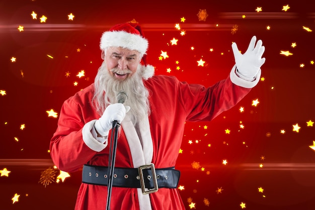 Composite image of portrait of santa claus singing christmas songs