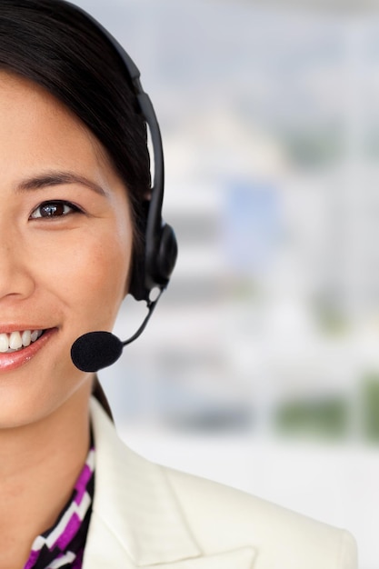 Composite image of radiant businesswoman using binoculars