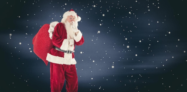 Composite image of santa asking for quiet with bag