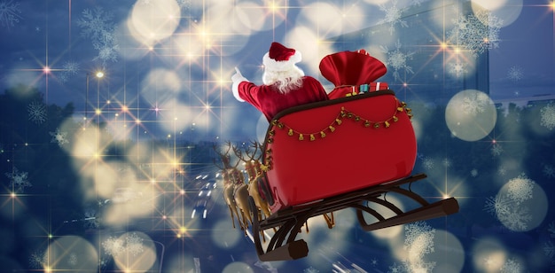 Composite image of santa claus riding on sled with gift box