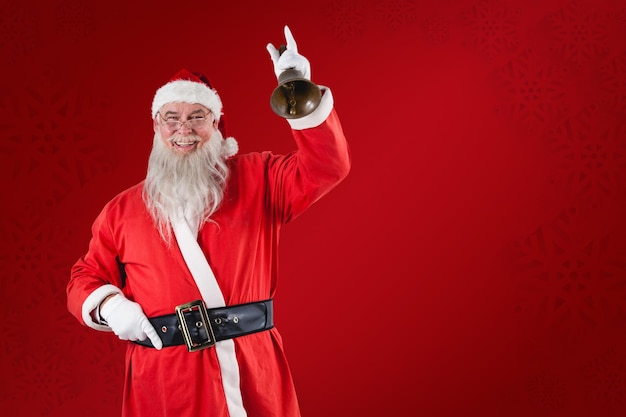 Composite image of santa claus ringing a bell