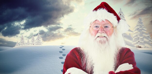 Composite image of santa smiles with folded arms