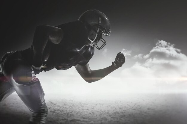 Composite image of silhouette american football player running