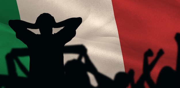 Composite image of silhouettes of football supporters