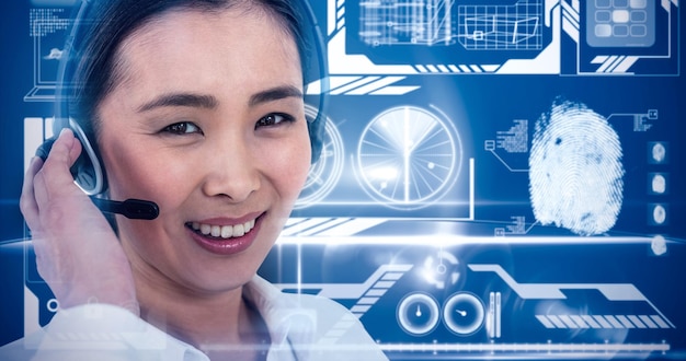 Composite image of smiling businesswoman using headset