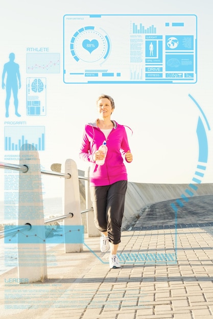 Composite image of smiling sporty woman jogging at promenade