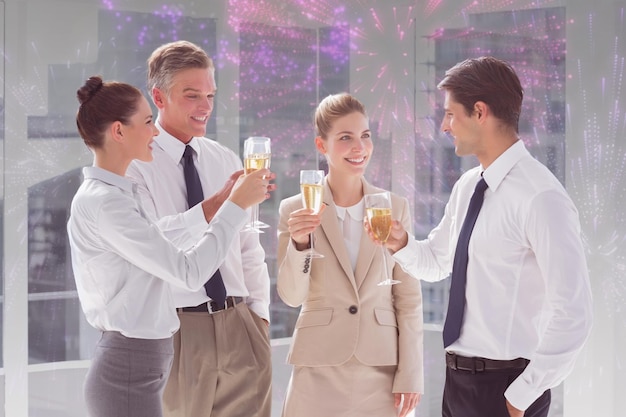 Composite image of smiling team of business people clinking their flutes of champagne