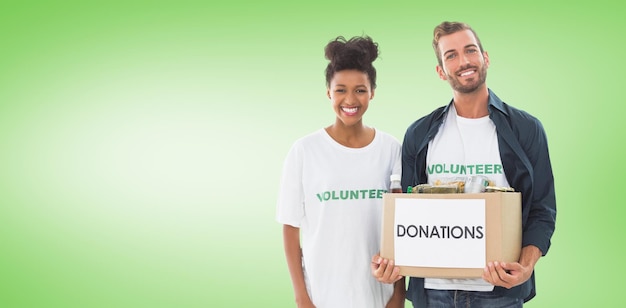 Composite image of smiling young couple with clothes donation