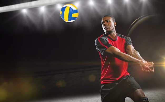 Composite image of sportsman playing volleyball