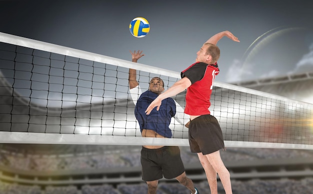 Composite image of sportsmen are playing volleyball