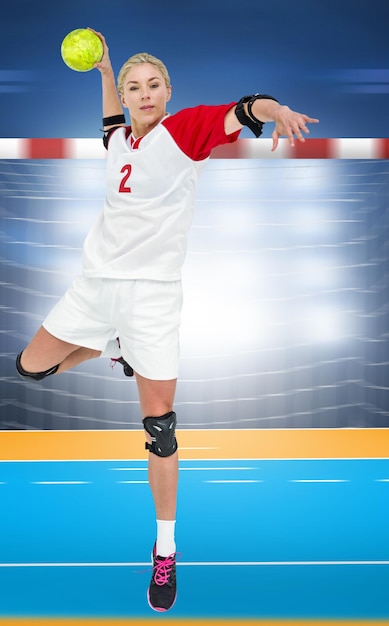 Composite image of sportswoman throwing a ball