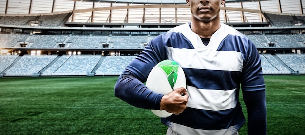 Composite image of strong rugby player