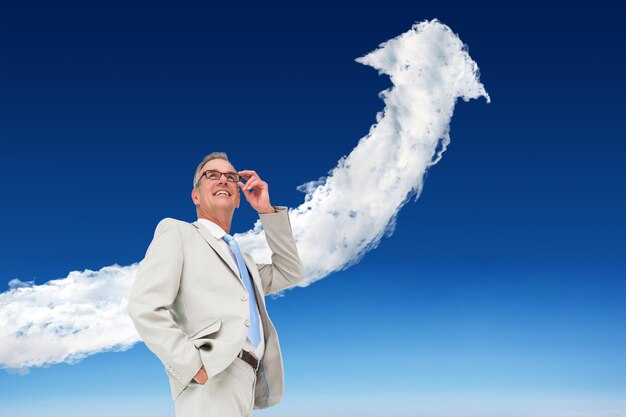 Photo composite image of thinking businessman against cloud arrow