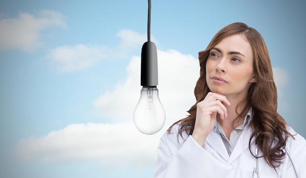 Composite image of thoughtful brunette doctor looking away