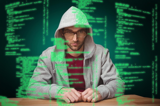 Photo composite image of thoughtful man with hooded shirt sitting at desk