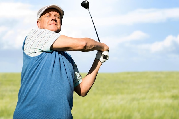 Composite image of view of a man playing golf