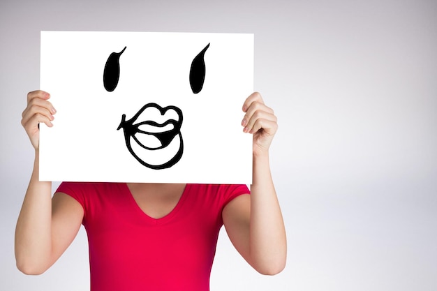 Composite image of woman in pink tshirt showing card