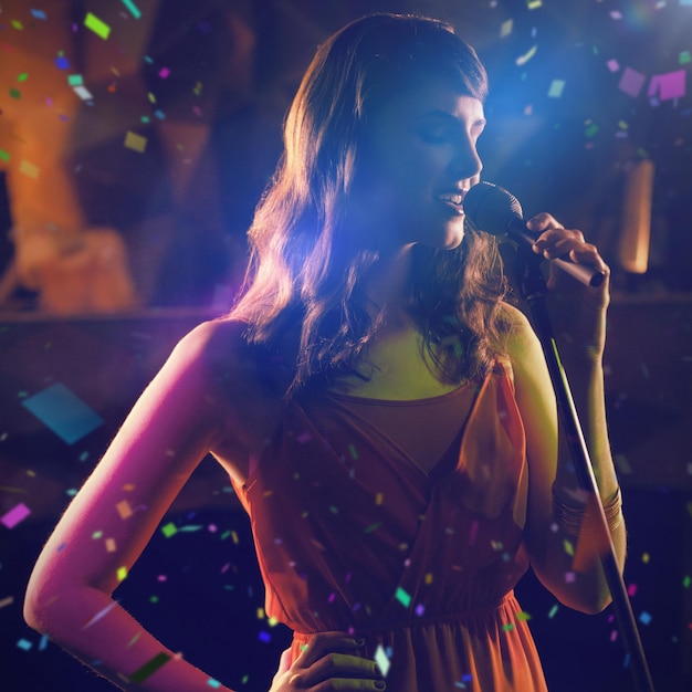 Composite image of woman singing in bar