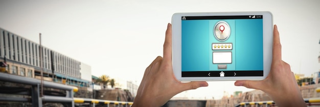 Composite image of womans hand holding digital tablet