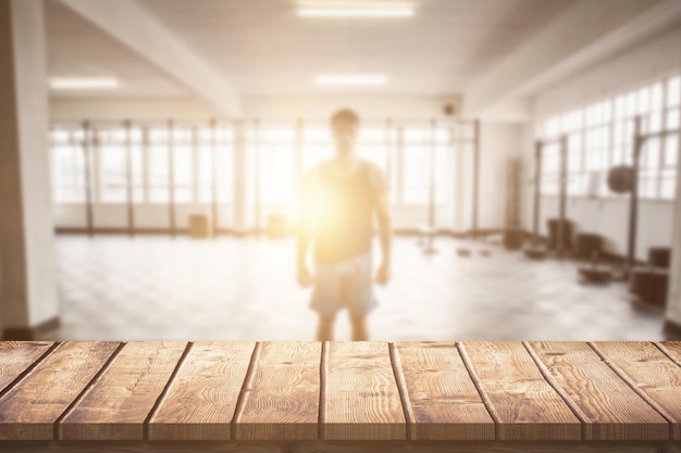 Composite image of young bodybuilder posing in front of the camera