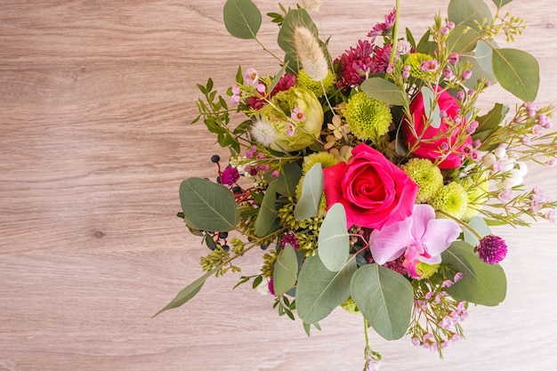 Photo composition of autumn flowers in a hat box