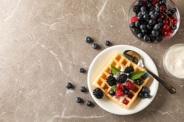 Composition of breakfast with belgian waffle