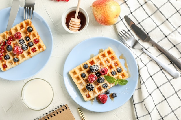 Composition of breakfast with belgian waffles