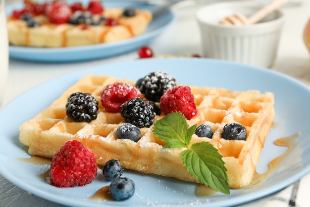 Composition of breakfast with belgian waffles