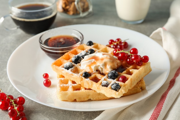 Composition of breakfast with belgian waffles