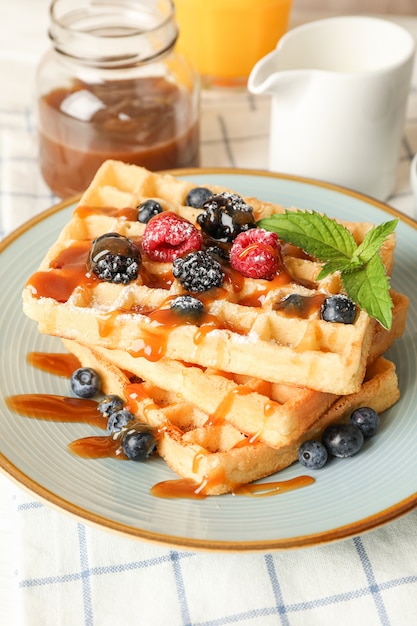 Composition of breakfast with belgian waffles